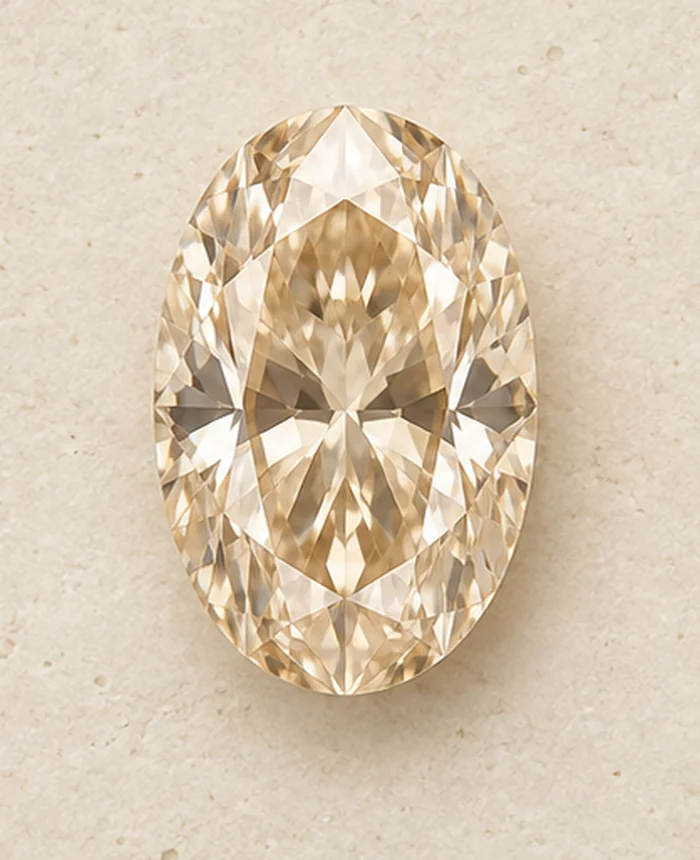 Illustrative pale champagne oval diamond